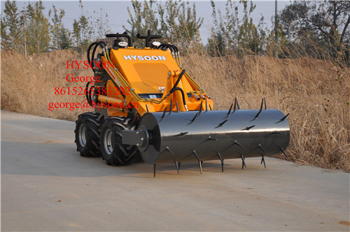 mini loader with lawn scarifier